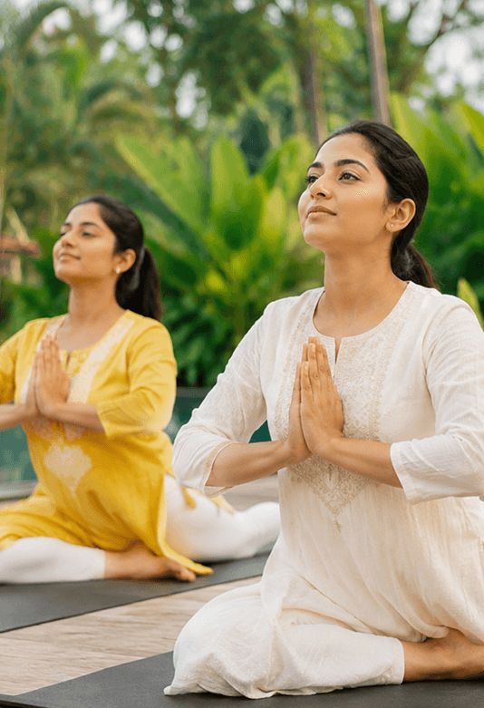 A group practicing yoga together in a park.