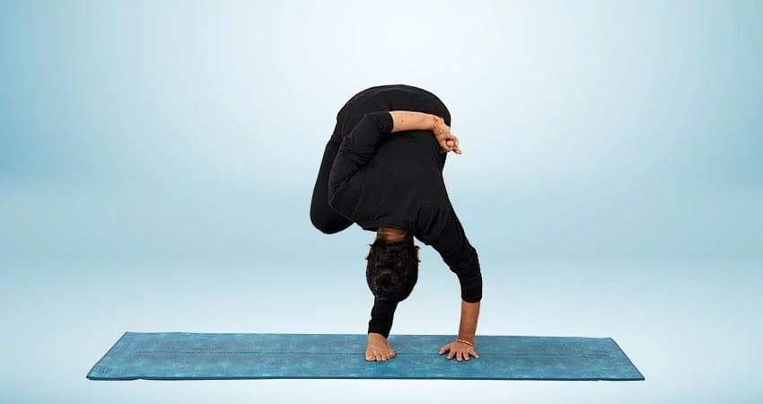 Half Bound Lotus Standing Forward Bend